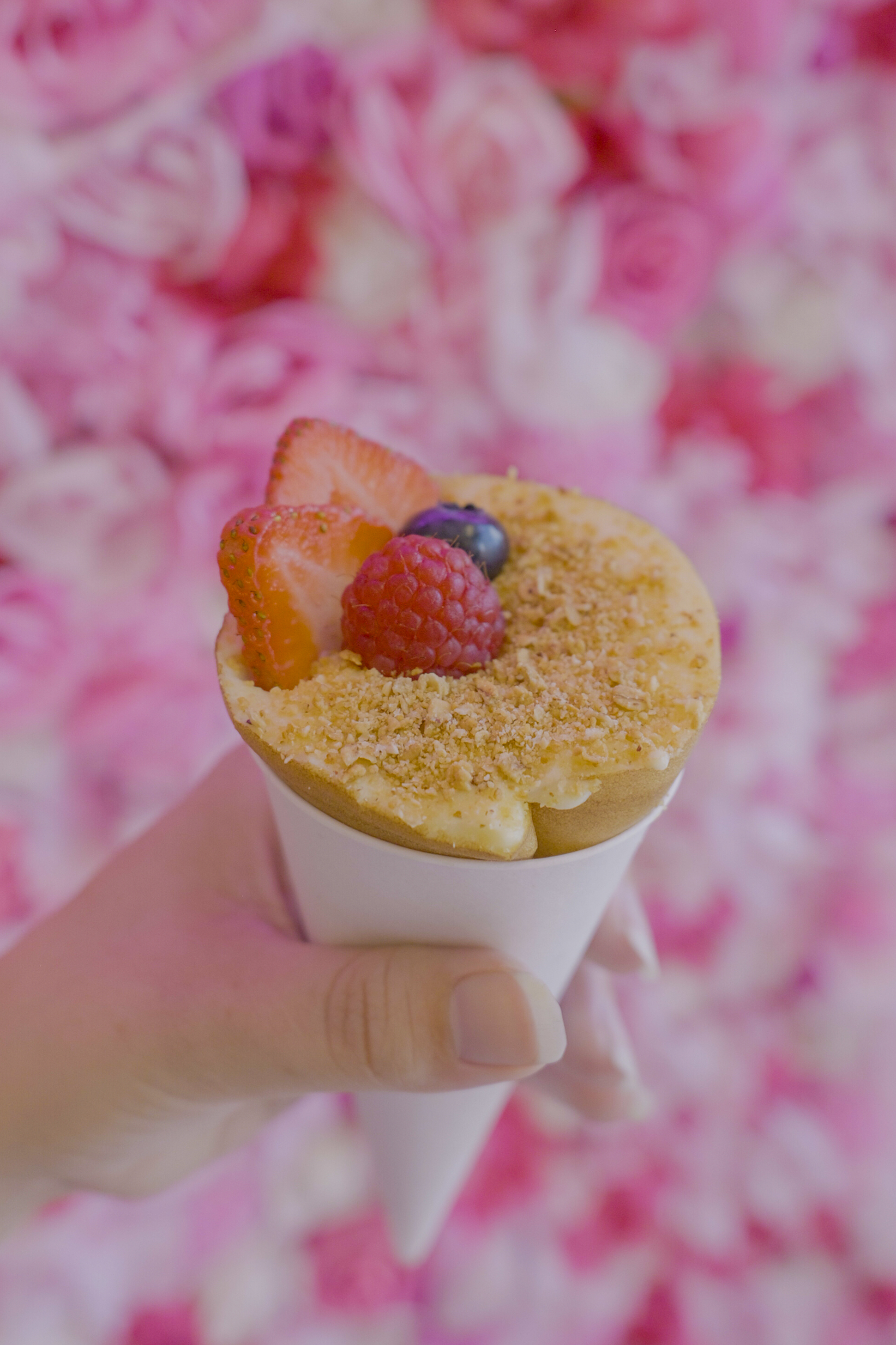 Branded food photography featuring a fruit-topped crepe